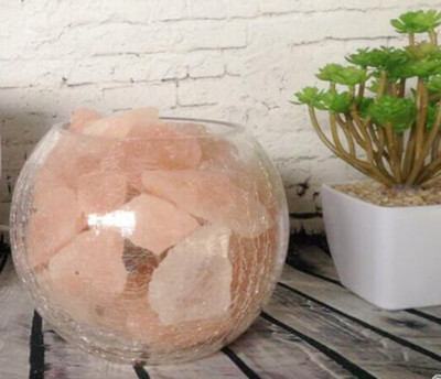 Himalayan salt chunks in the clear glass bowl.