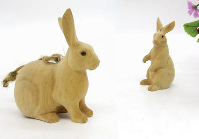 hand carved wood rabbits